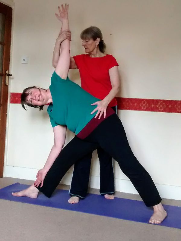 Yoga Triangle pose - assisted - Trikonasana